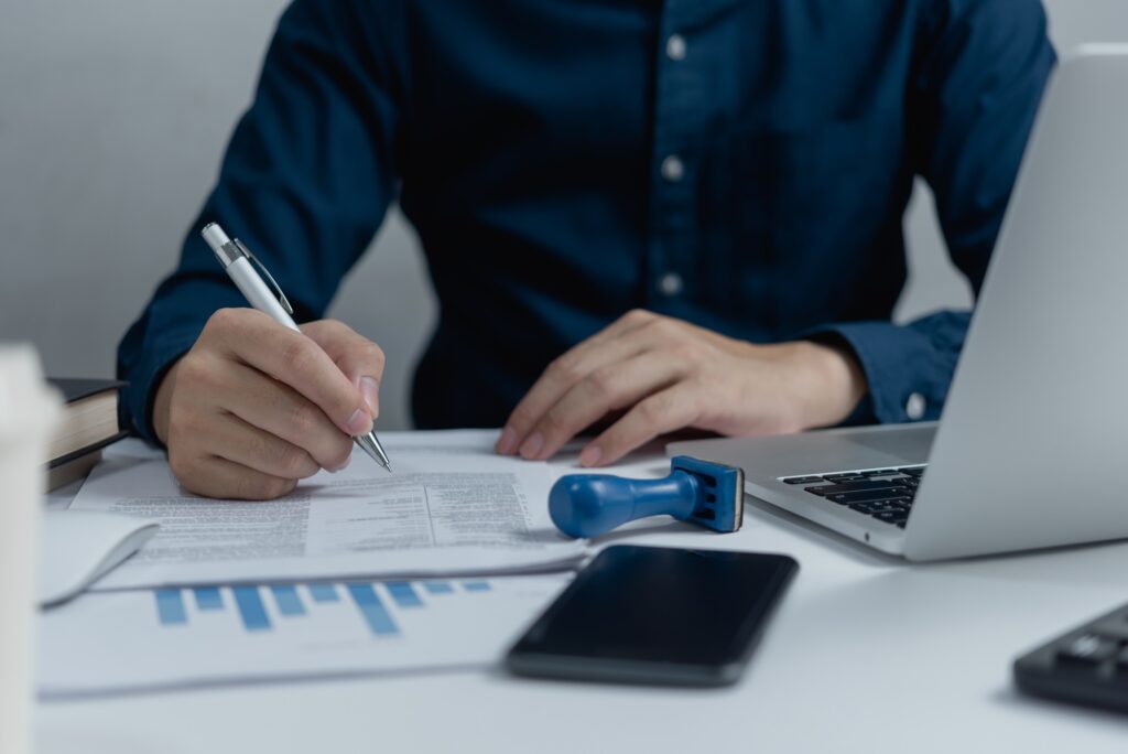 businessman agree to make deal signing document, sale contract or legal transaction contract at desk