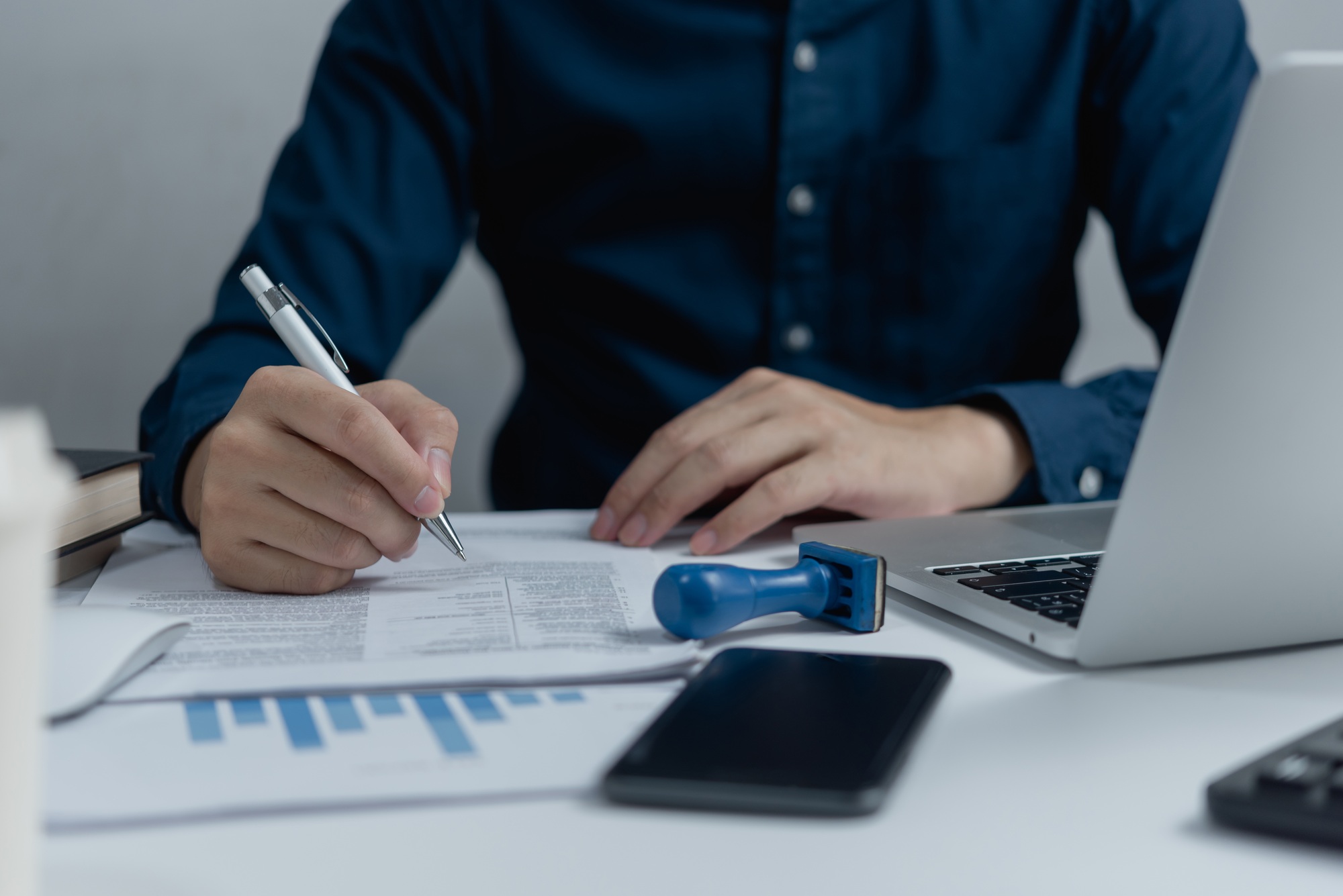 businessman agree to make deal signing document, sale contract or legal transaction contract at desk